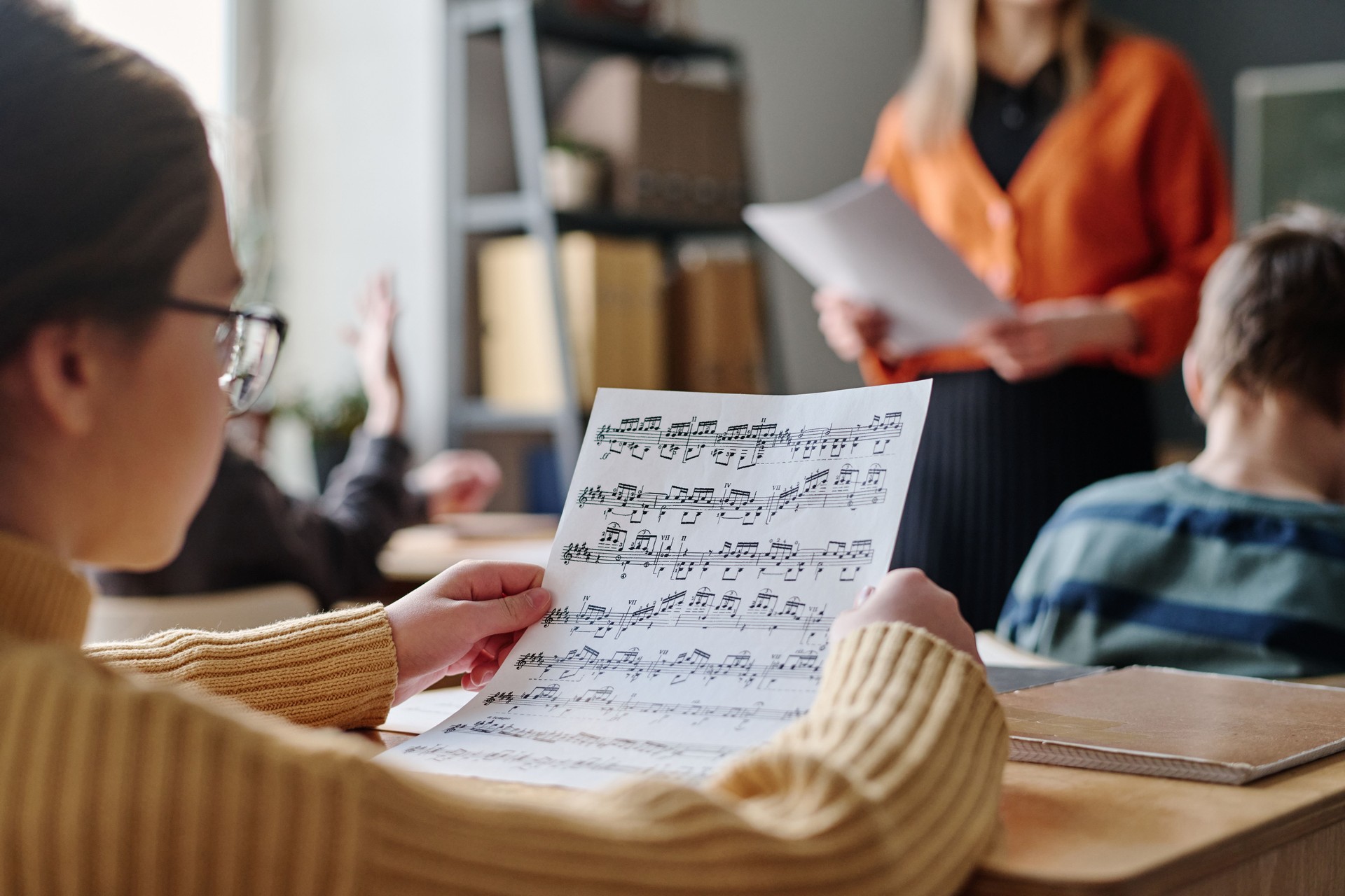 Girl Looking At Sheet Music During Lesson